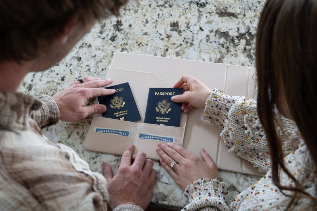 ewlywed couple reviewing their marriage certificate and organizing important post-wedding paperwork at home.