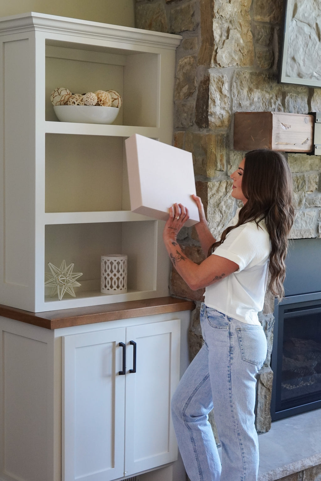 Bride putting newlywed binder on shelf